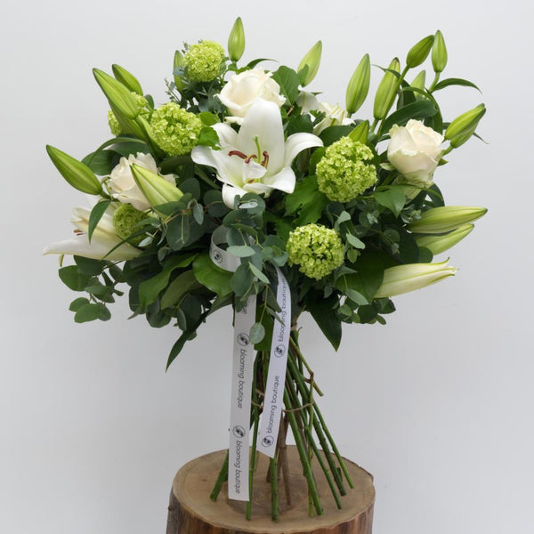 The amazing combination of pure white Lilies and Roses highlighted with a touch of Eucalyptus and Viburnum brings the complete elegance for your loved ones. Please place your order by 1 pm for Same Day Flower Delivery Dublin or Next Day Flowers Delivery Ireland