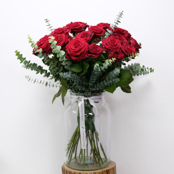 The Pure and Simple Beauty of Magnificent Velvet Red Roses. Our Deluxe Red Roses Bouquet Consists of 12 or 24 Magnificently Red Roses and Few Sprigs of Elegant Eucalyptus. Please Place Your Order by 1 pm for Same Day Flower Delivery Dublin or Next Day Flowers Delivery Ireland