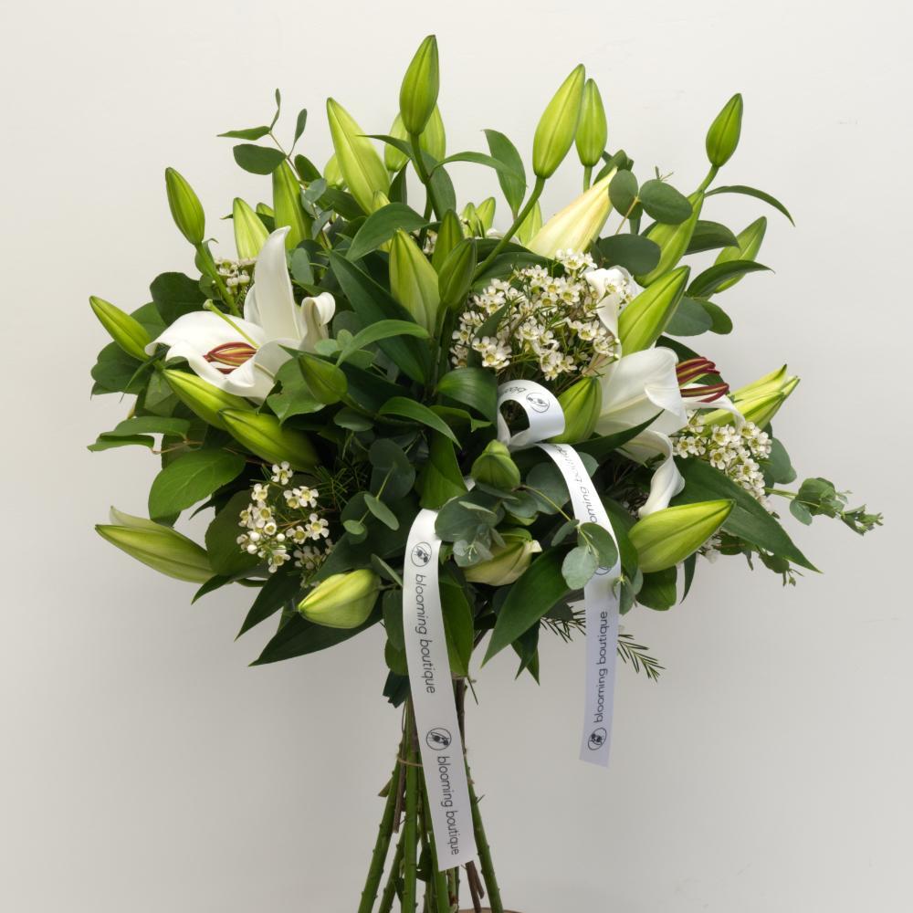 A gorgeous combination of pure white Lilies, Wax flowers, white Veronica, Tanacetum, and Eucalyptus is a delicate creation in favourite and elegant white shades. We deliver flowers throughout Dublin and Ireland. Please place your order by 1 pm for Same Day Flower Delivery Dublin or Next Day Flowers Delivery Ireland